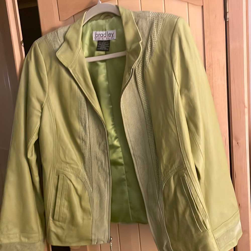 Lined leather bomber jacket with front zipper, pockets. Light lime green color.